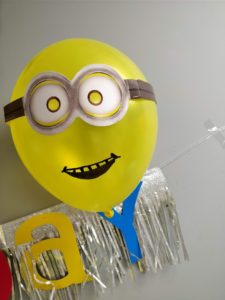 . I used Canva to design a birthday Minion Image, and got it printed on edible paper to top off the cake.