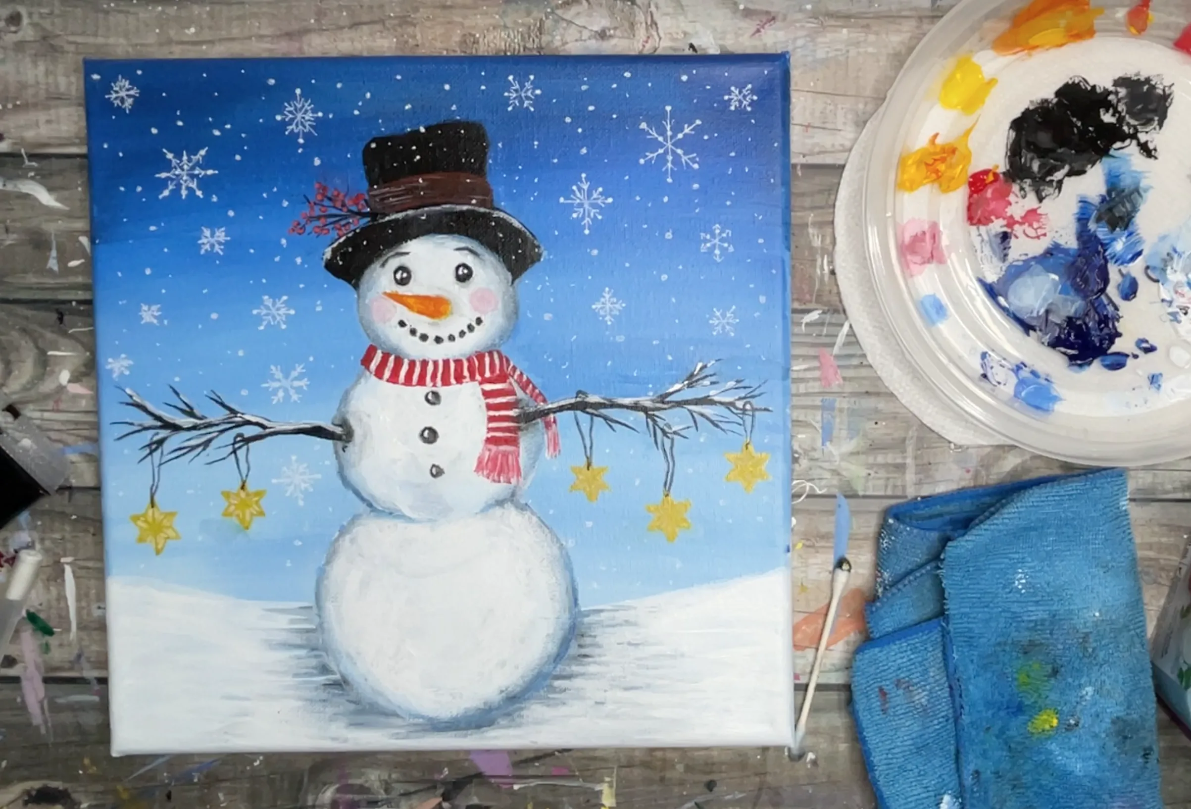 snowman painting with snowflakes